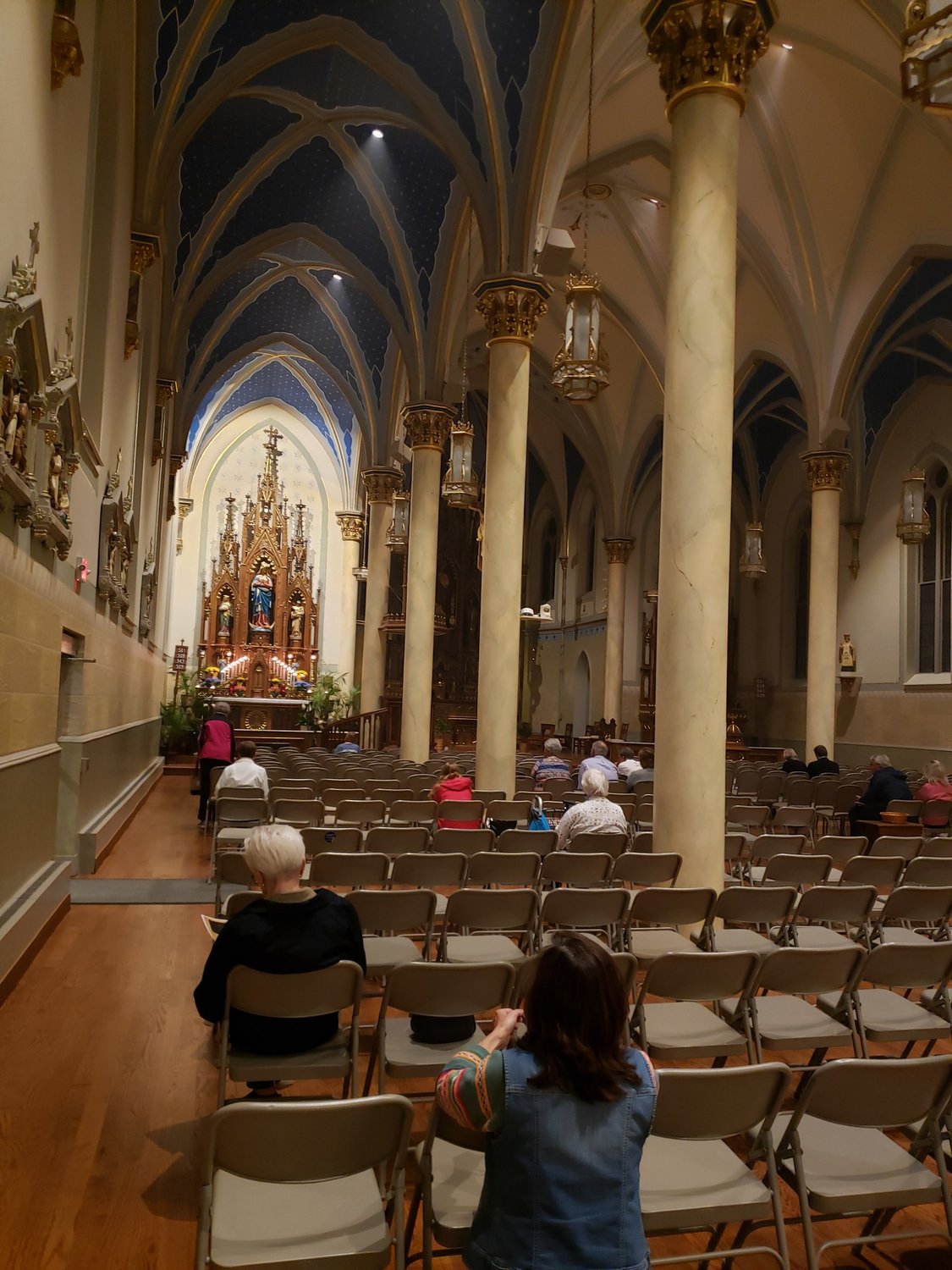 People visit the altar of repose in St. Peter Church in Jefferson City.